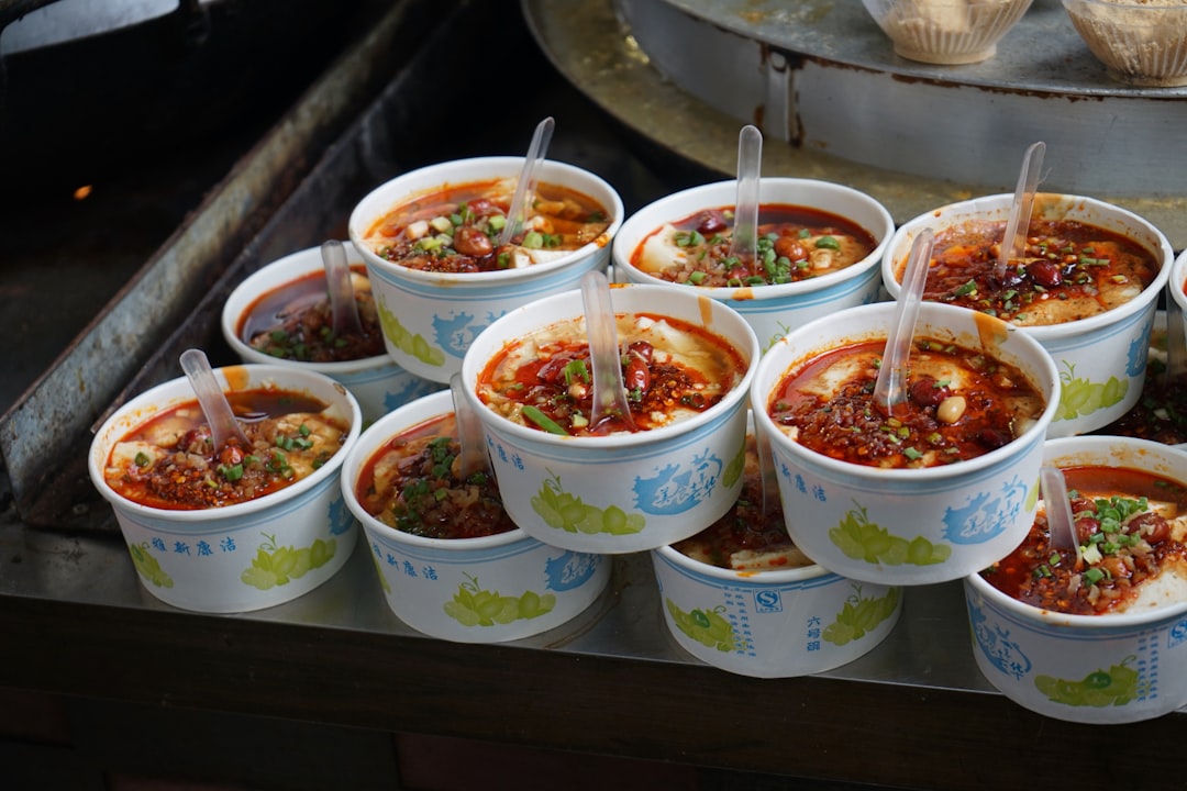 Bowls of boat noodles served at a small street-side table in Bangkok's Ari neighborhood