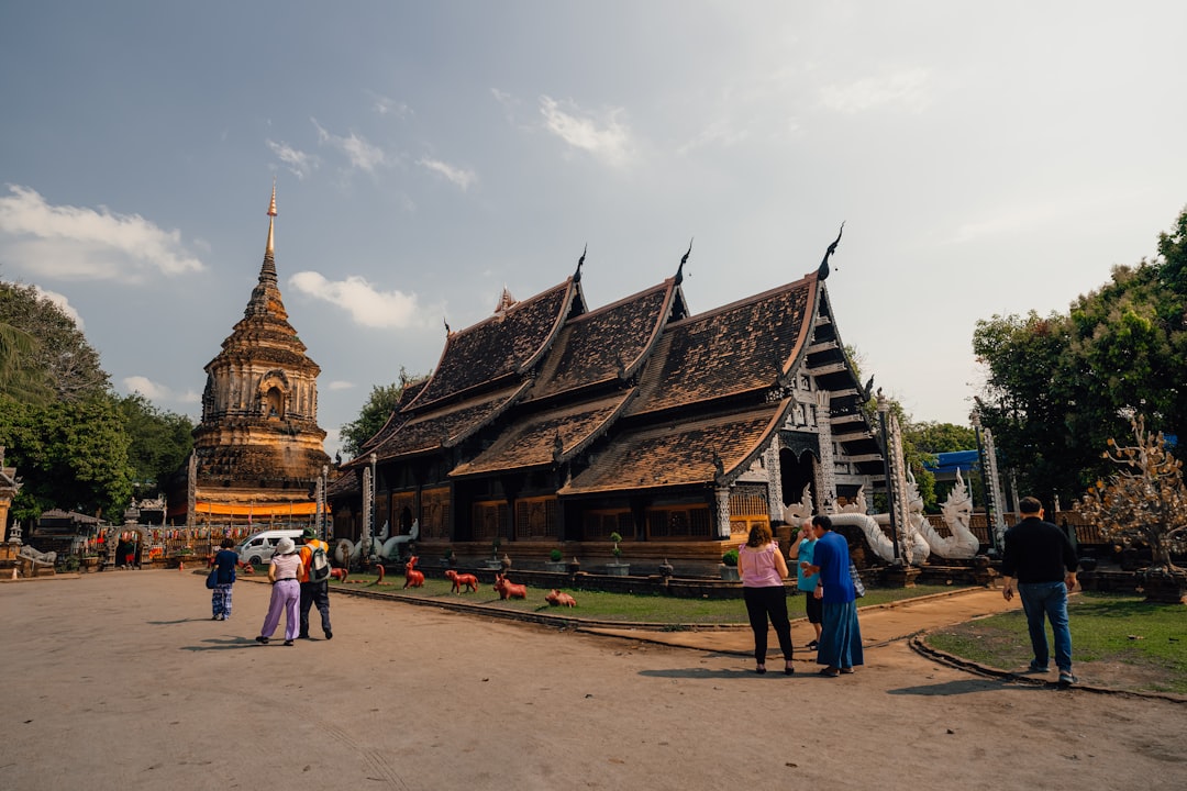 The elephant-buttressed chedi at Wat Chiang Man, Chiang Mai's oldest temple, surrounded by lush gardens